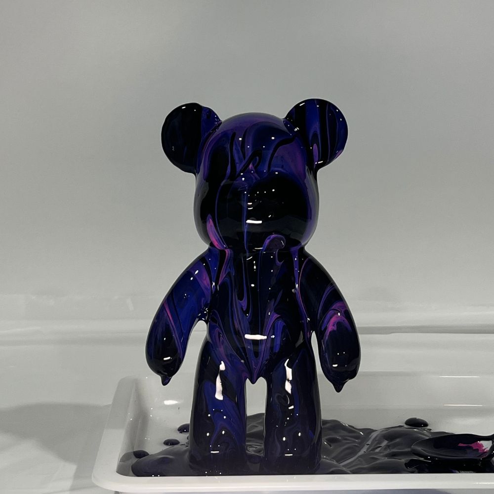 Bearbrick canvas covered in black, purple and pink paint