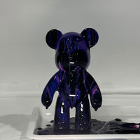 Bearbrick canvas covered in black, purple and pink paint